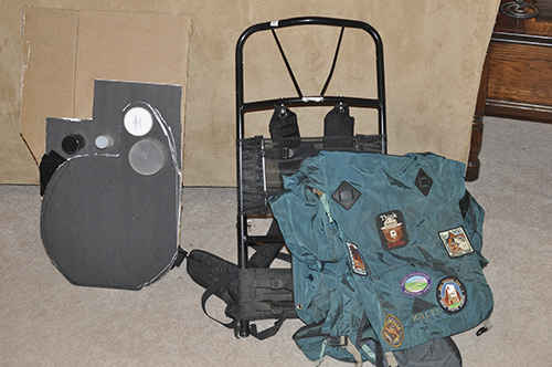 The proton pack in progress next to an old backcountry backpack.