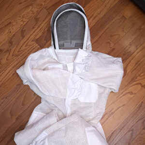 Photo of a beekeeper suit, laying on the floor