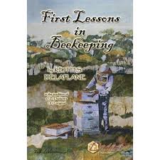 Book cover of "First Lessons in Beekeeping". Cover is a painting of a beekeeper in a bee suit, working with hives.