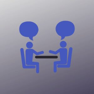 icon of two people at a table, facing each other, talking