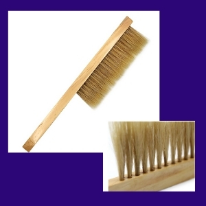 photo of wooden brush as part of a list of gifts for new beekeepers